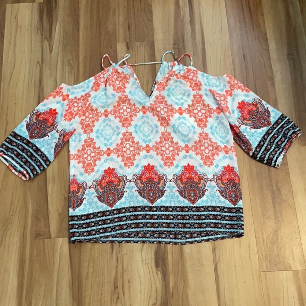 Skies are Blue off the shoulder blouse in a size small.